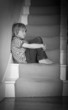 Sad boy on stairs
