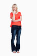 Thoughtful teenager standing upright with her fingers on chin