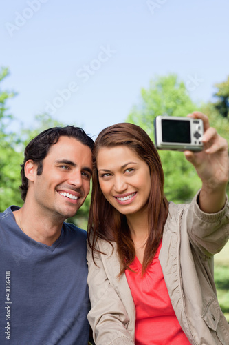 Photo: Woman and her friend looking towards her camera for a picture of Woman and her friend looking towards her camera for a picture of