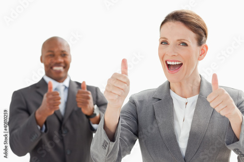 Photo: Excited businesspeople with thumbs up Excited businesspeople with thumbs up