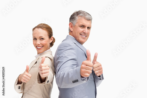 Photo: Portrait of business people approving back to back Portrait of business people approving back to back