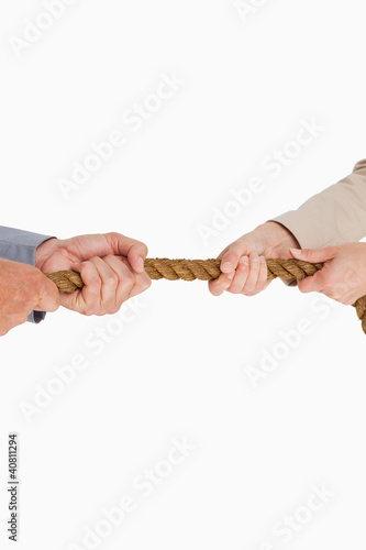 Photo: Business people pulling the rope Business people pulling the rope