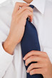 Man tightening his tie