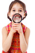 Girl showing teeth through a magnifier