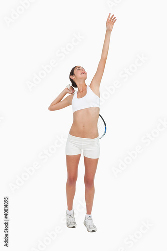 Photo: Slim woman playing tennis in white clothes Slim woman playing tennis in white clothes