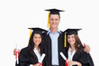 Three friends graduate from college together