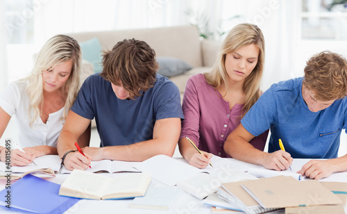 Photo: Four students studying hard Four students studying hard