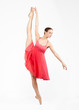 young beautiful ballerina on a gray background