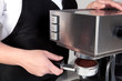 Photo: Barista using an espresso machine. Barista using an espresso machine.
