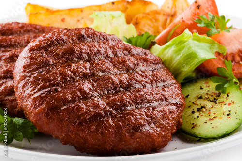 Photo: Grilled beefsteak, baked potatoes and vegetables Grilled beefsteak, baked potatoes and vegetables