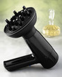 Foto: Black Hair Dryer with perfume in a glass bottle Black Hair Dryer with perfume in a glass bottle