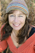 Photo: A happy smiling mature woman with freckles. A happy smiling mature woman with freckles.
