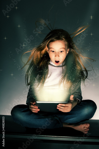 Photo: Surprised girl with tablets Surprised girl with tablets
