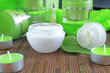 Photo: creams for body care in transparent and green containers creams for body care in transparent and green containers