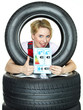 Apprentice shows thumb up for tire label on white backround