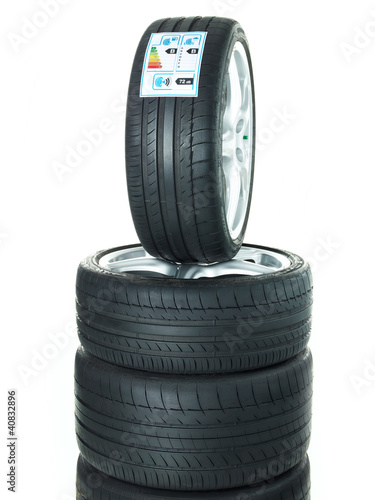 Photo: Isolated set of low profile summer tyres with quality label Isolated set of low profile summer tyres with quality label