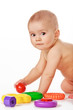 Small child play with toys on white background