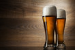 Two glass beer on wood background with copyspace