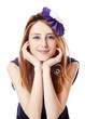 Beautiful redhead girl with paper hat over head.