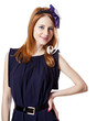 Beautiful redhead girl with paper hat over head.