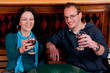 Young man and woman drinking beer