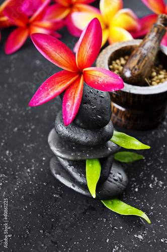 Photo: Pink Frangipani with zen stone for Spa concept Pink Frangipani with zen stone for Spa concept