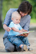 Mother with son reading a book Mother with son reading a book