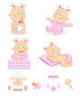 Lovely baby girl with toys and accessories in pink color