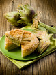 vegetarian quiche with artichoke on wood background vegetarian quiche with artichoke on wood background