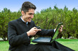 Young man with cell phones and laptop. Young man with cell phones and laptop.