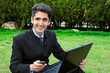 Young man with cell phones and laptop. Young man with cell phones and laptop.