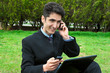 Young man with cell phones and laptop. Young man with cell phones and laptop.
