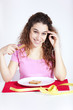 .Young woman eating toast