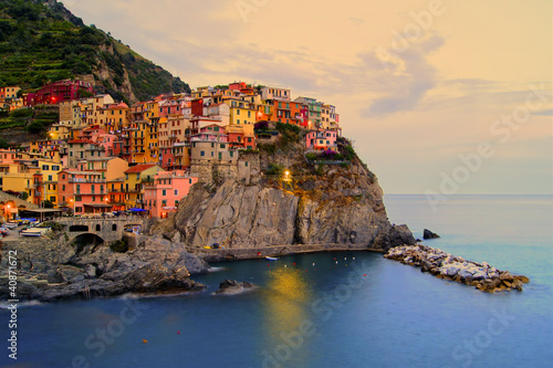 Photo: Manarola, Italy on the Cinque Terre coast at sunset Manarola, Italy on the Cinque Terre coast at sunset
