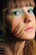 Photo: Beautiful Fashion Woman girl with feather of peacock Beautiful Fashion Woman girl with feather of peacock