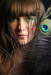 Photo: Beautiful Fashion Woman girl with feather of a peacock Beautiful Fashion Woman girl with feather of a peacock
