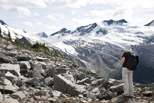 Photo: A tourist admiring glaciers in Glacier National Park A tourist admiring glaciers in Glacier National Park