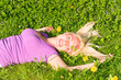 young woman resting on the meadow