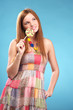 Beautiful young woman with lollipop
