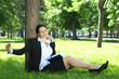 Businesswoman relaxing in park