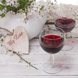 spring blossom, wine and heart on wood background spring blossom, wine and heart on wood background