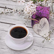 spring blossom, coffee and heart on wood background spring blossom, coffee and heart on wood background