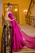 woman in a long dress lying on the stairs