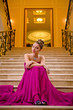 woman in a long dress lying on the stairs