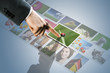touchscreen interface: man hand reaching images on the screen