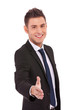 Business man offering a handshake Business man offering a handshake