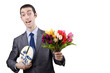 Businessman with giftbox and flowers