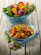 mixed sauteed vegetables on dish over wood background mixed sauteed vegetables on dish over wood background