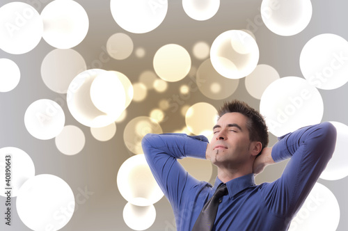 Foto: Dreaming Businessman in front of Bubbles Dreaming Businessman in front of Bubbles