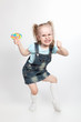 Capricious little girl with lollipop